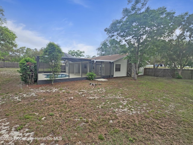 18232 Monteverde Dr, Spring Hill Pasco, FL 34610 - rear view of house with a fenced backyard, a lanai, and a patio area