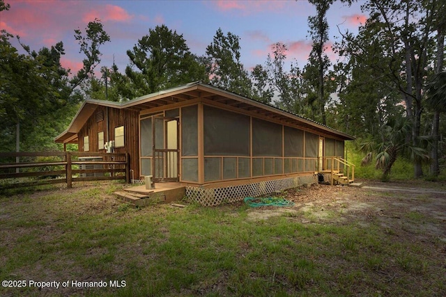 1518 Palm St, Steinhatchee, FL 32359 - view of front facade with a sunroom