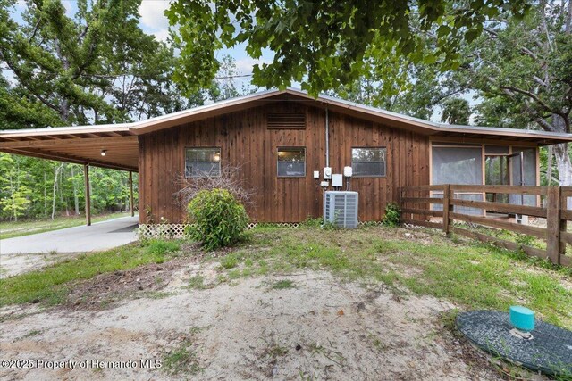 1518 Palm St, Steinhatchee, FL 32359 - view of home's exterior featuring an attached carport and concrete driveway