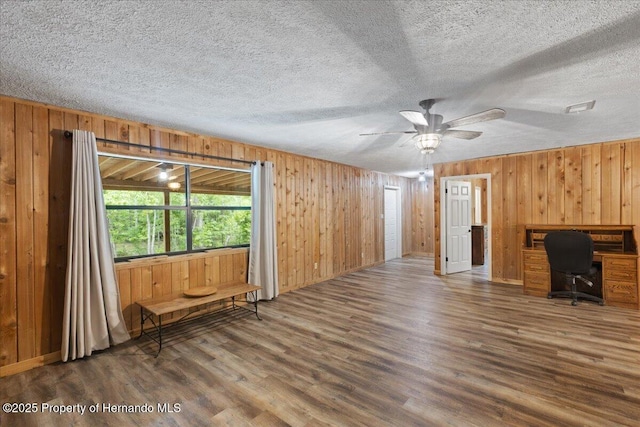 1518 Palm St, Steinhatchee, FL 32359 - unfurnished office featuring wood finished floors, a textured ceiling, wooden walls, and a ceiling fan