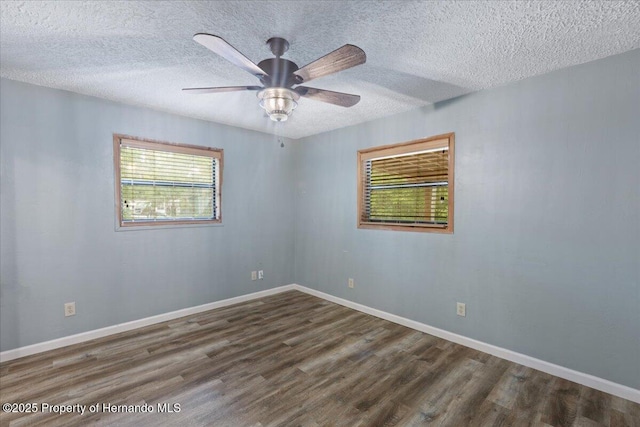 1518 Palm St, Steinhatchee, FL 32359 - empty room with wood finished floors, a textured ceiling, and ceiling fan