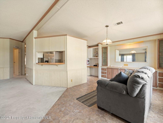 8017 Fiat Ave, Brooksville, FL 34613 - carpeted living area with a textured ceiling, ornamental molding, and wood walls