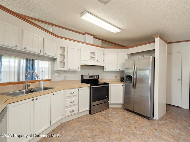 8017 Fiat Ave, Brooksville, FL 34613 - kitchen with stainless steel appliances, vaulted ceiling, a textured ceiling, under cabinet range hood, and white cabinetry