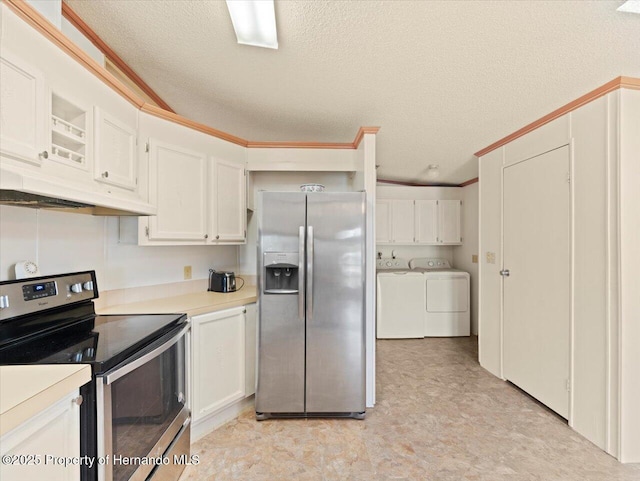 8017 Fiat Ave, Brooksville, FL 34613 - kitchen with stainless steel appliances, separate washer and dryer, under cabinet range hood, white cabinets, and light flooring
