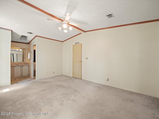 8017 Fiat Ave, Brooksville, FL 34613 - unfurnished bedroom with crown molding, vaulted ceiling, carpet flooring, a textured ceiling, and ceiling fan