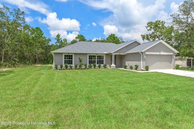 12128 Petrel Ave, Brooksville, FL 34614 - ranch-style home featuring a garage, a front yard, driveway, and stucco siding