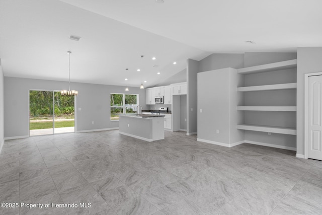 12128 Petrel Ave, Brooksville, FL 34614 - unfurnished living room with a chandelier, lofted ceiling, recessed lighting, and built in shelves