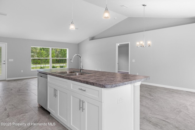 12128 Petrel Ave, Brooksville, FL 34614 - kitchen with dishwasher, vaulted ceiling, an island with sink, dark countertops, and white cabinetry
