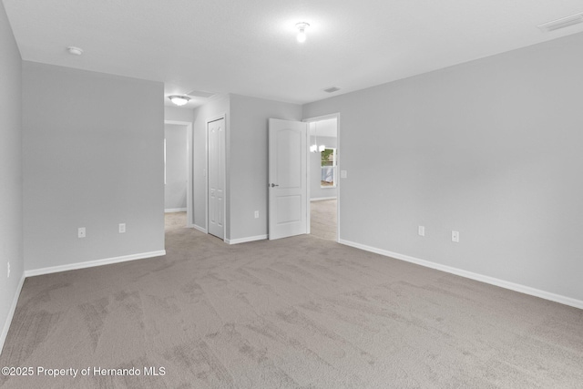 12128 Petrel Ave, Brooksville, FL 34614 - carpeted spare room with baseboards