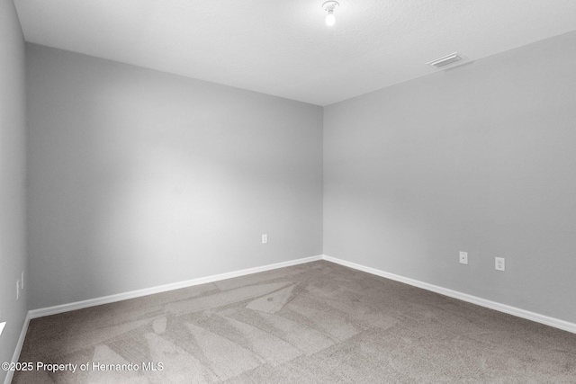 12128 Petrel Ave, Brooksville, FL 34614 - carpeted spare room featuring baseboards