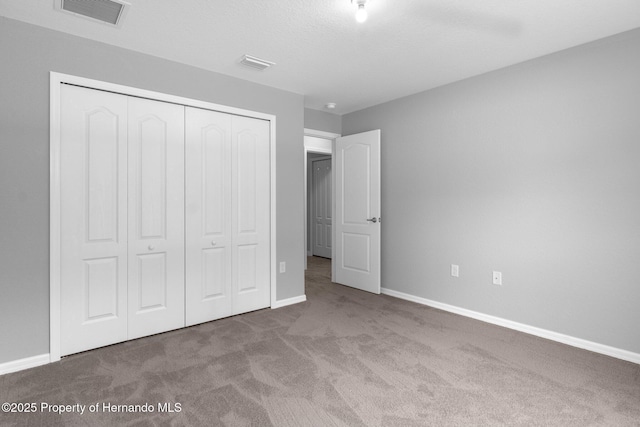 12128 Petrel Ave, Brooksville, FL 34614 - unfurnished bedroom with carpet and a closet