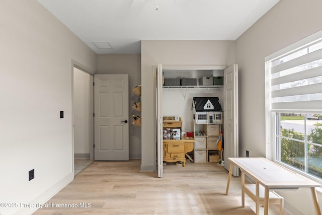12948 Conquistador Loop, Spring Hill Pasco, FL 34610 - bedroom with light wood-style flooring and a closet