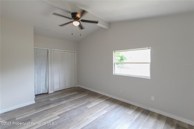9345 N Elliot Way, Citrus Springs, FL 34434 - unfurnished bedroom featuring wood finished floors and ceiling fan