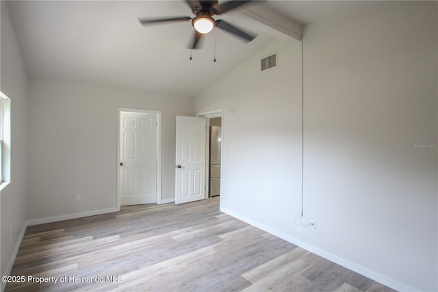 9345 N Elliot Way, Citrus Springs, FL 34434 - unfurnished bedroom featuring wood finished floors, beam ceiling, fridge, high vaulted ceiling, and ceiling fan