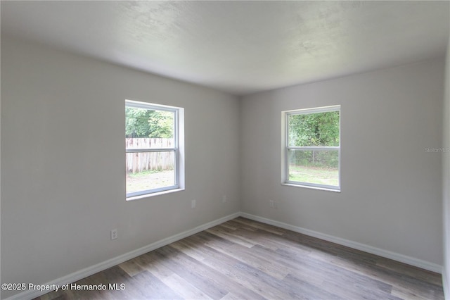 9345 N Elliot Way, Citrus Springs, FL 34434 - spare room featuring wood finished floors