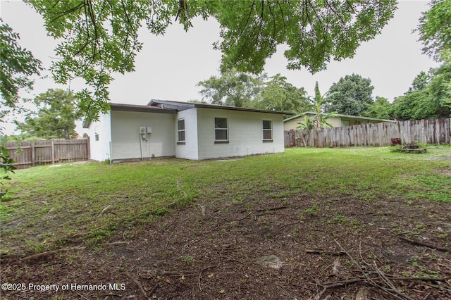 9345 N Elliot Way, Citrus Springs, FL 34434 - back of house featuring a fenced backyard