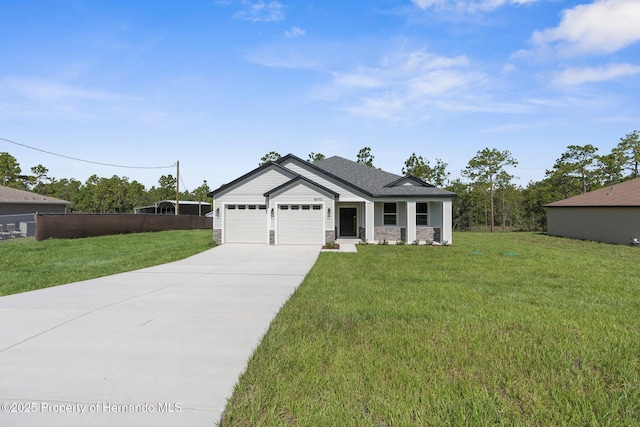 16113 Penn State Rd, Weeki Wachee, FL 34614 - view of front of house with driveway, stone siding, and a garage