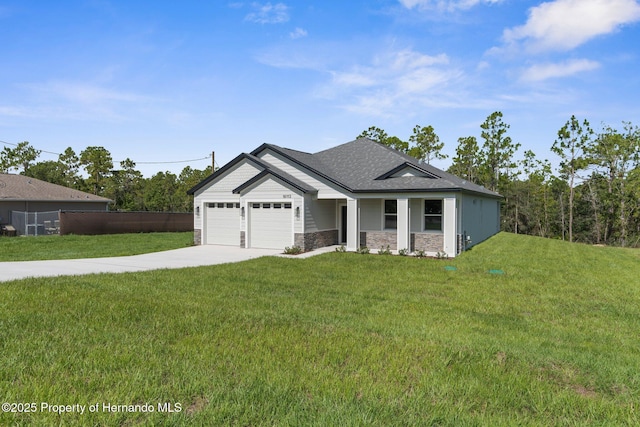 16113 Penn State Rd, Weeki Wachee, FL 34614 - view of front of home with concrete driveway, an attached garage, stone siding, and a shingled roof