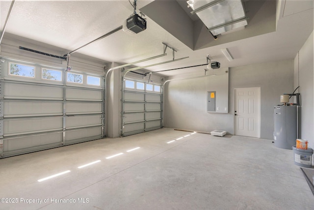 16113 Penn State Rd, Weeki Wachee, FL 34614 - garage featuring electric water heater, a garage door opener, and electric panel