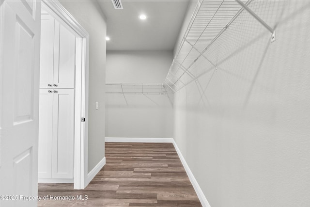 16113 Penn State Rd, Weeki Wachee, FL 34614 - spacious closet with wood finished floors