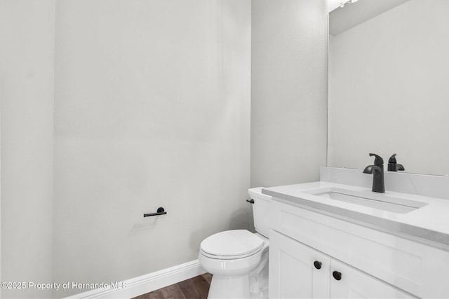16113 Penn State Rd, Weeki Wachee, FL 34614 - half bath with vanity and wood finished floors
