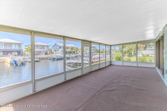 4016 Centavo Ct, Hernando Beach, FL 34607 - unfurnished sunroom featuring healthy amount of natural light and a water view