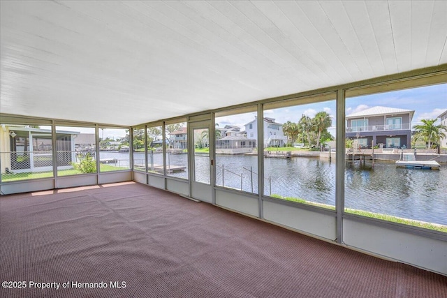 4016 Centavo Ct, Hernando Beach, FL 34607 - unfurnished sunroom with a water view, healthy amount of natural light, and a residential view