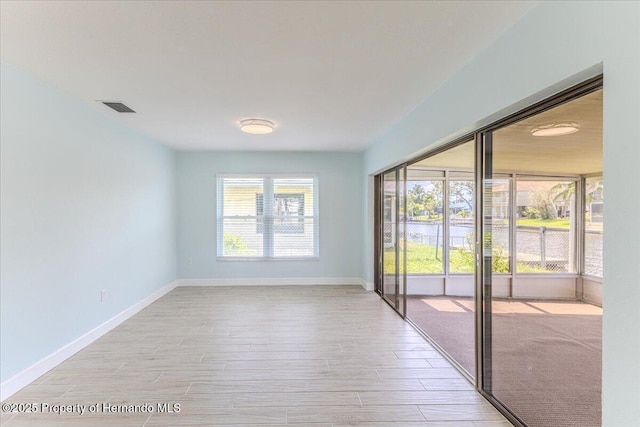 4016 Centavo Ct, Hernando Beach, FL 34607 - unfurnished room with light wood finished floors and baseboards