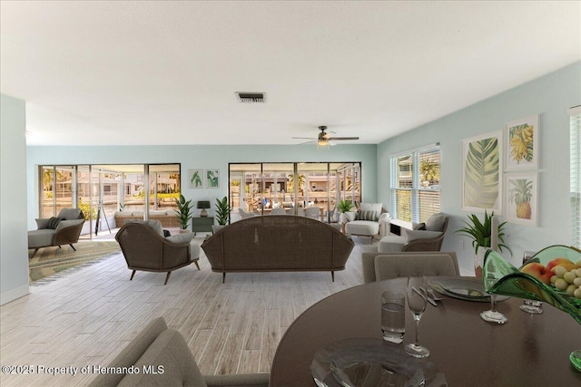 4016 Centavo Ct, Hernando Beach, FL 34607 - living room featuring ceiling fan and light wood finished floors