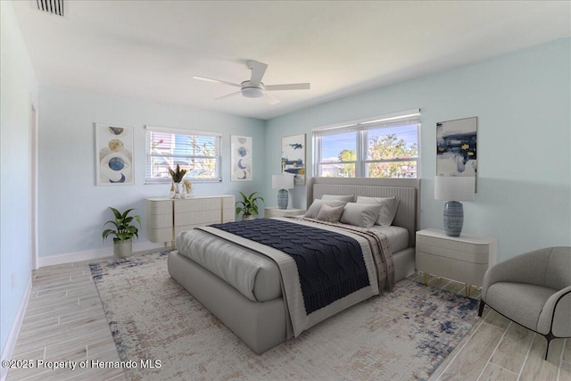4016 Centavo Ct, Hernando Beach, FL 34607 - bedroom featuring multiple windows, wood finished floors, and ceiling fan