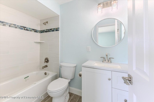 4016 Centavo Ct, Hernando Beach, FL 34607 - bathroom with vanity, shower / bathtub combination, and wood finished floors