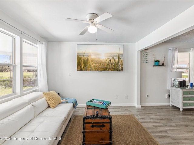 3579 Eagle Nest Dr, Hernando Beach, FL 34607 - living area with wood finished floors, plenty of natural light, and ceiling fan