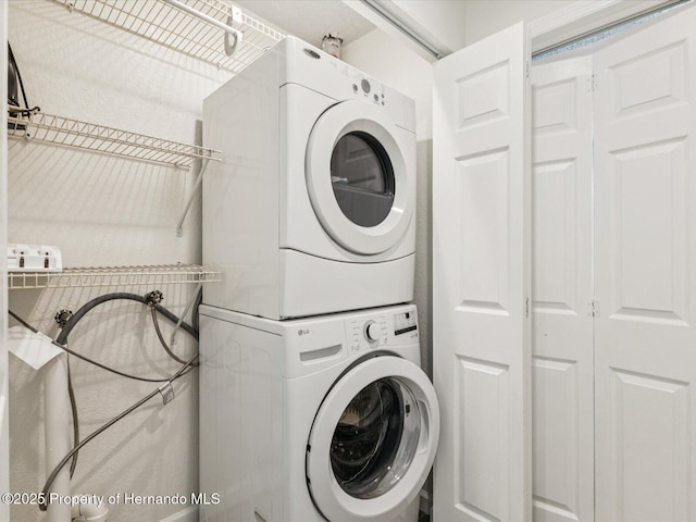 3579 Eagle Nest Dr, Hernando Beach, FL 34607 - laundry room featuring stacked washer / dryer