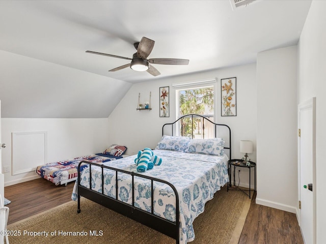 3579 Eagle Nest Dr, Hernando Beach, FL 34607 - bedroom featuring wood finished floors, vaulted ceiling, and ceiling fan