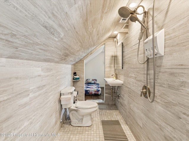 3579 Eagle Nest Dr, Hernando Beach, FL 34607 - full bath with wood ceiling, tile patterned floors, a tile shower, lofted ceiling, and tile walls