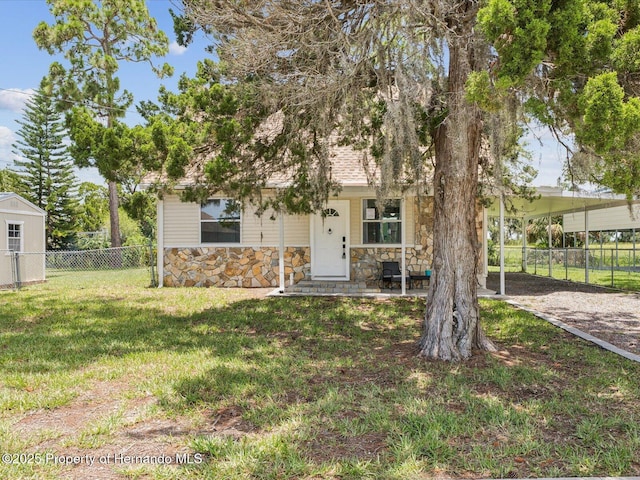 3579 Eagle Nest Dr, Hernando Beach, FL 34607 - obstructed view of property with stone siding and a porch