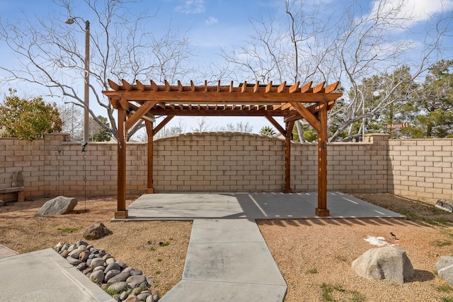 view of yard featuring a patio, a fenced backyard, and a pergola