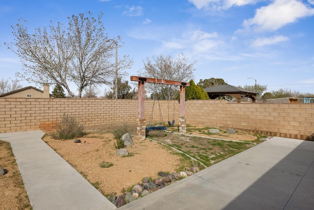 view of yard with a patio and a fenced backyard