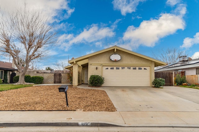 ranch-style home featuring stucco siding, driveway, a garage, and fence