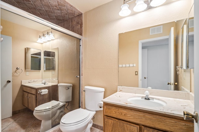 full bath with tile patterned flooring, toilet, vanity, and visible vents