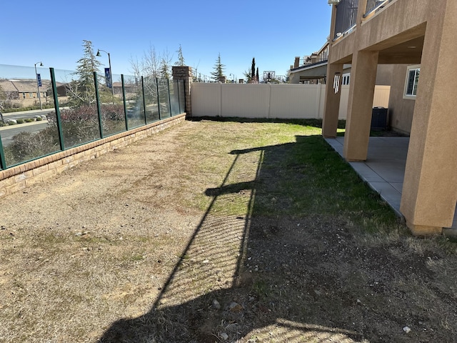 view of yard featuring a patio area and fence