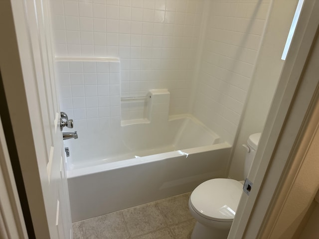 bathroom featuring toilet, shower / bathtub combination, and tile patterned flooring