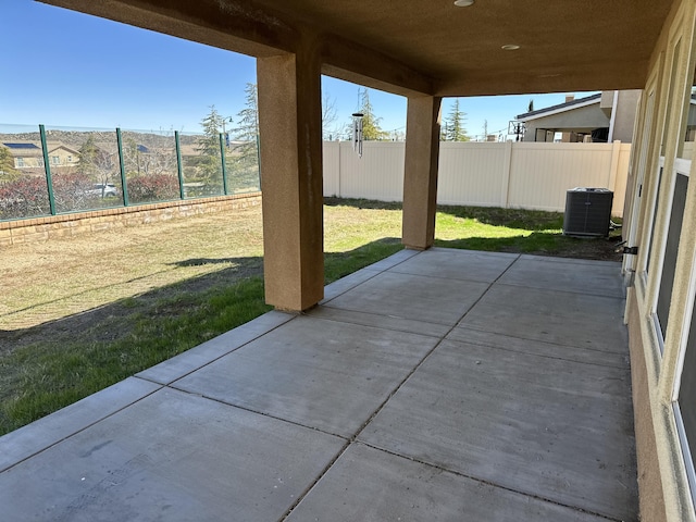 view of patio featuring cooling unit and a fenced backyard