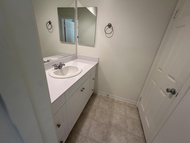 bathroom with baseboards and vanity