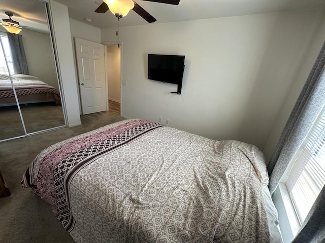 carpeted bedroom featuring a closet and ceiling fan