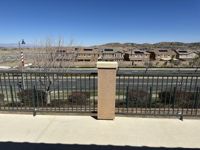 view of yard with a mountain view and a residential view