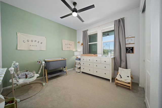 bedroom featuring a ceiling fan, carpet flooring, and baseboards