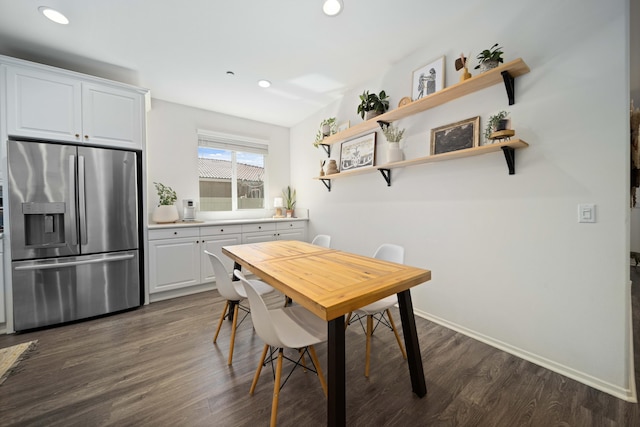 dining area with recessed lighting, dark wood finished floors, and baseboards