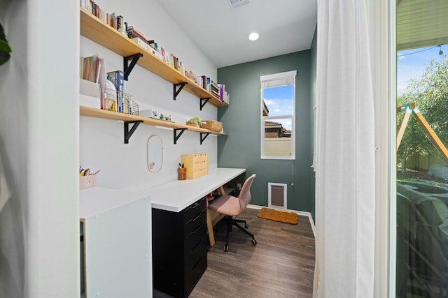 office featuring visible vents and wood finished floors