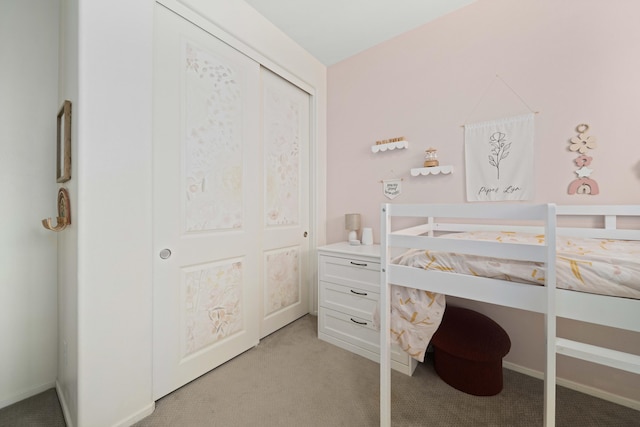 bedroom featuring light colored carpet